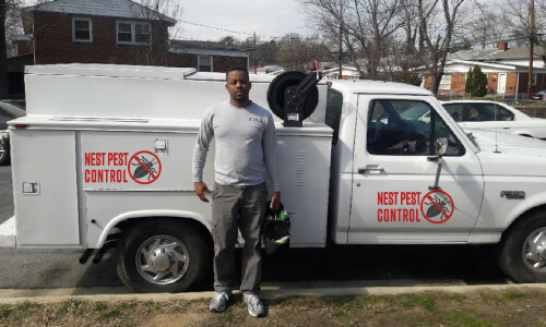 James in front of white truck for Nest Pest Control services in Washington DC